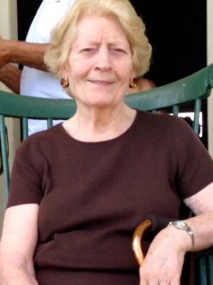 My mom visiting Mount Vernon, VA, cane at her side.